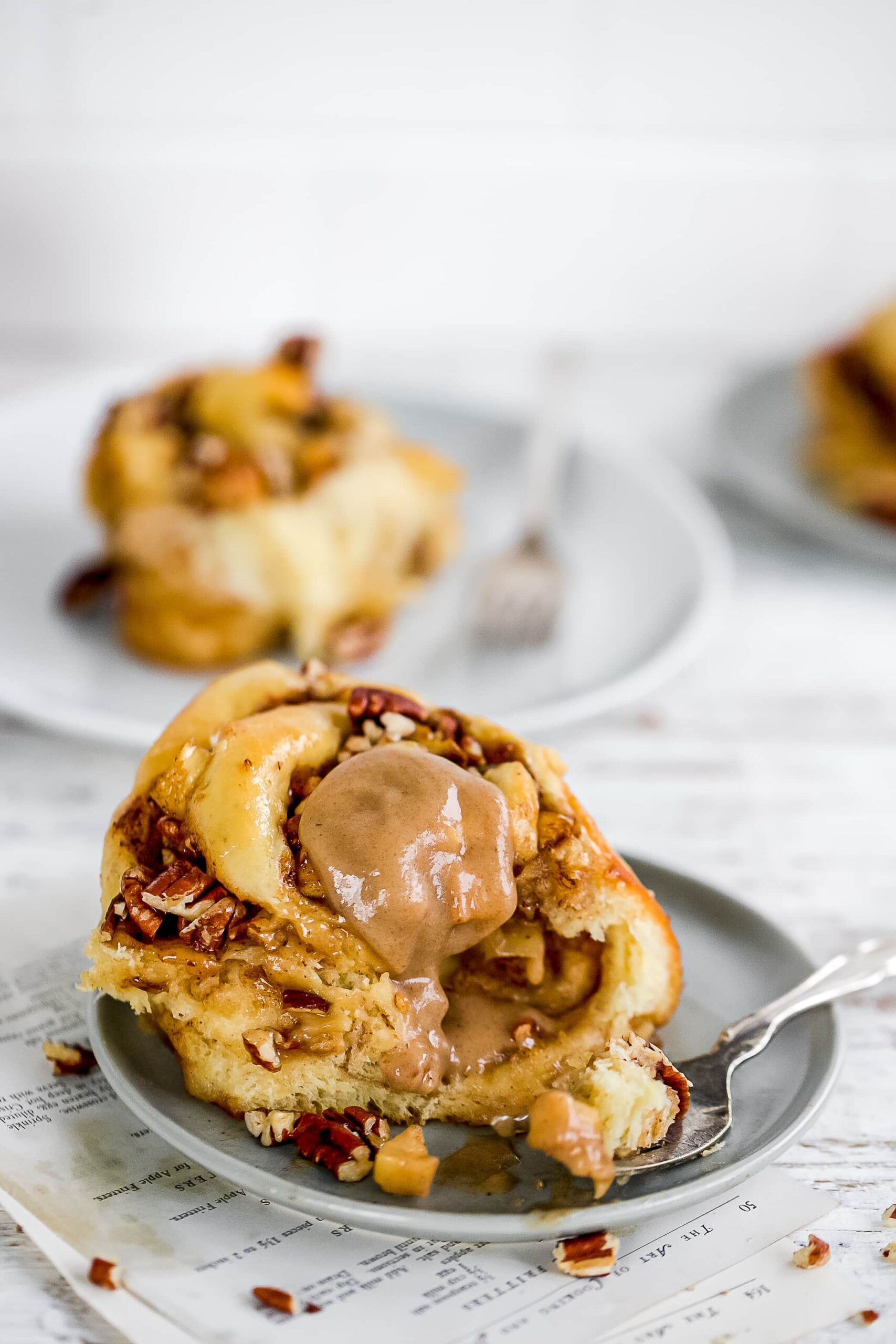 Cinnamon rolls with apple pie filling on a plate with fork