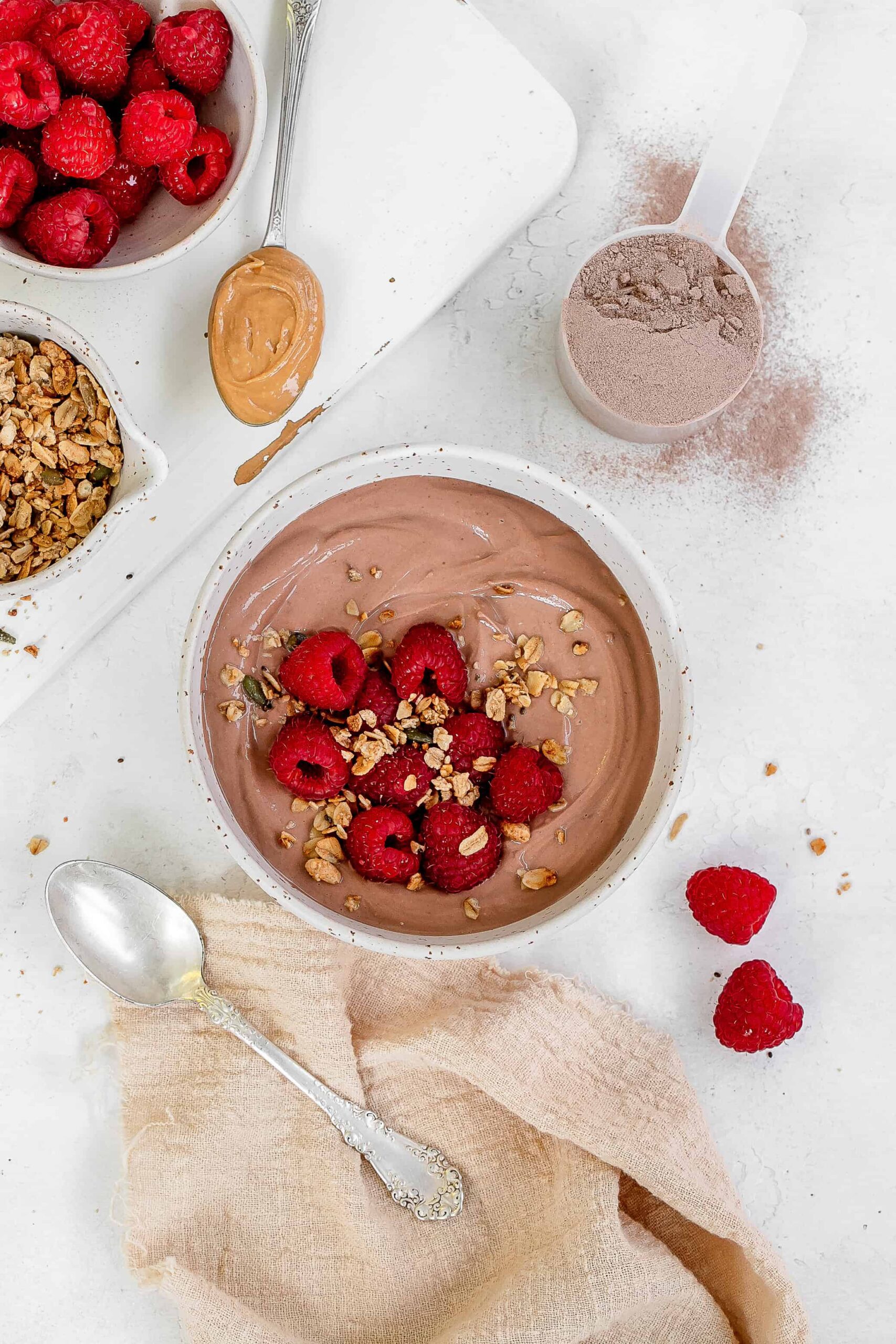 greek yogurt with protein powder in a bowl with berries.