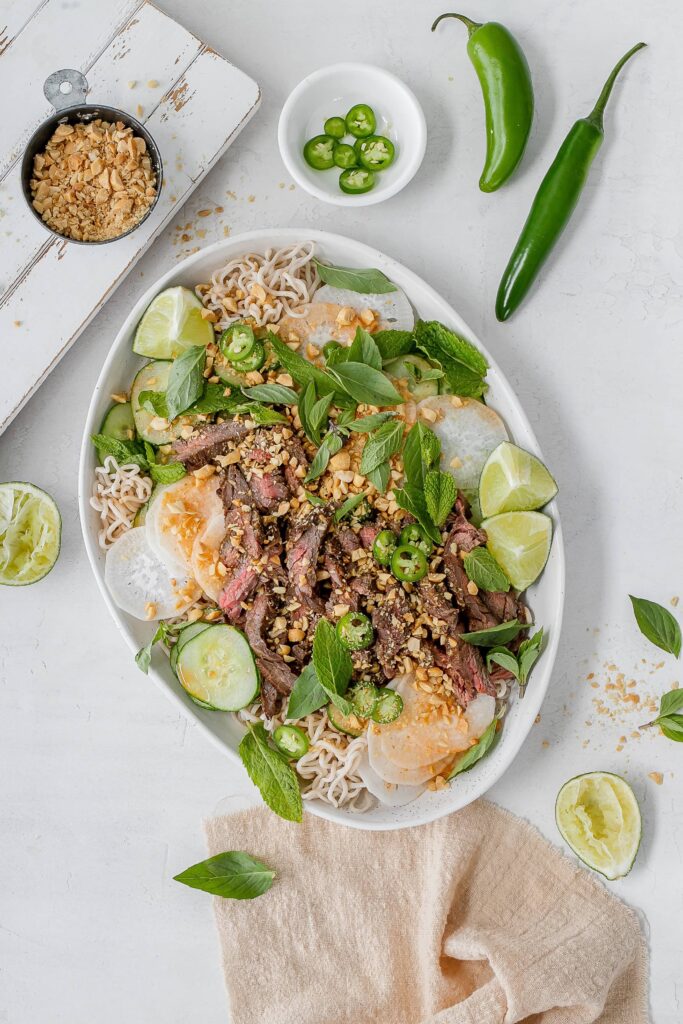 Thai beef noodle salad on a platter.