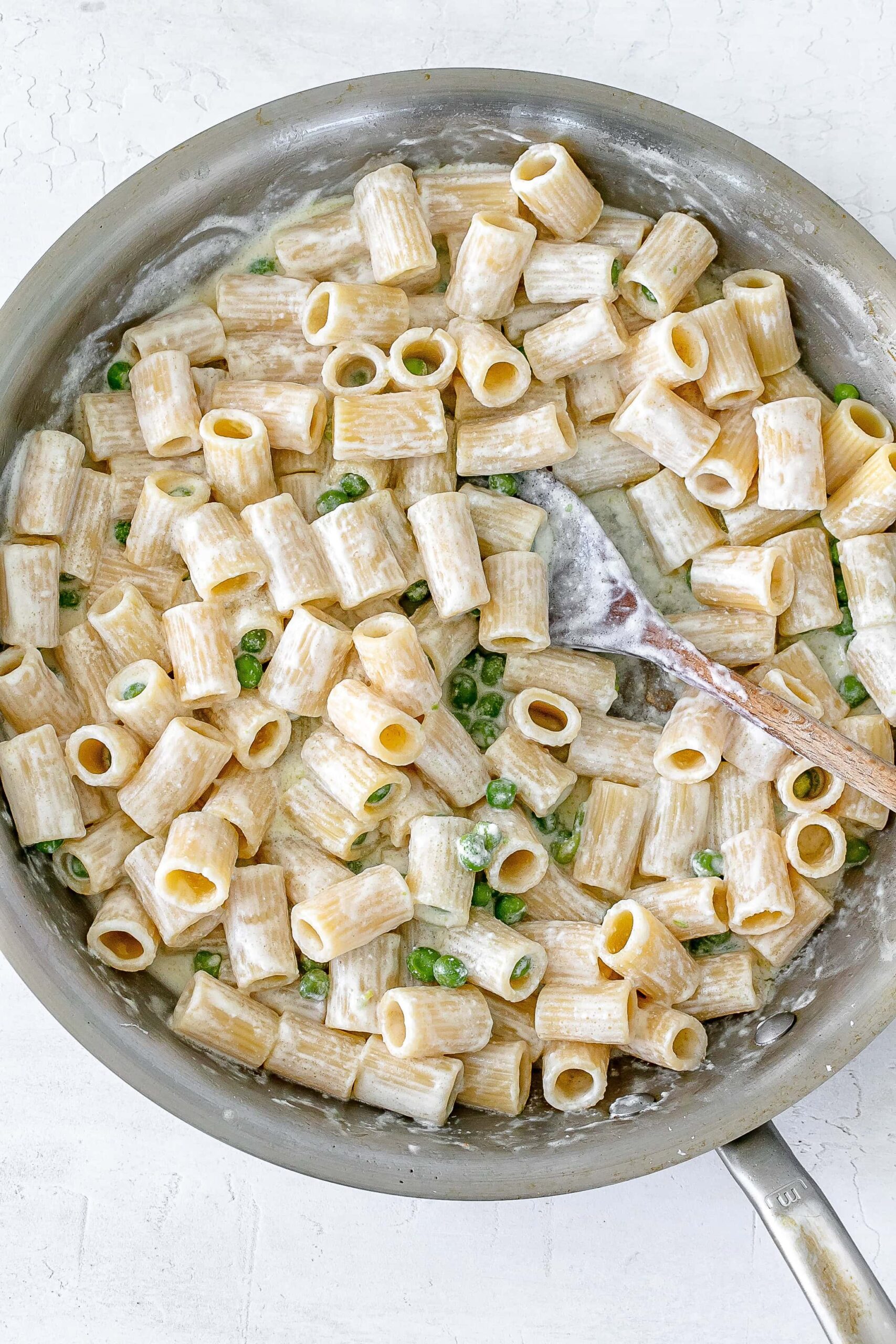 creamy ricotta pasta tossed in pan.