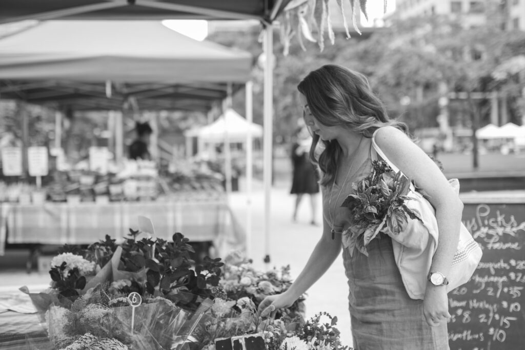 picking out flowers at farmers market