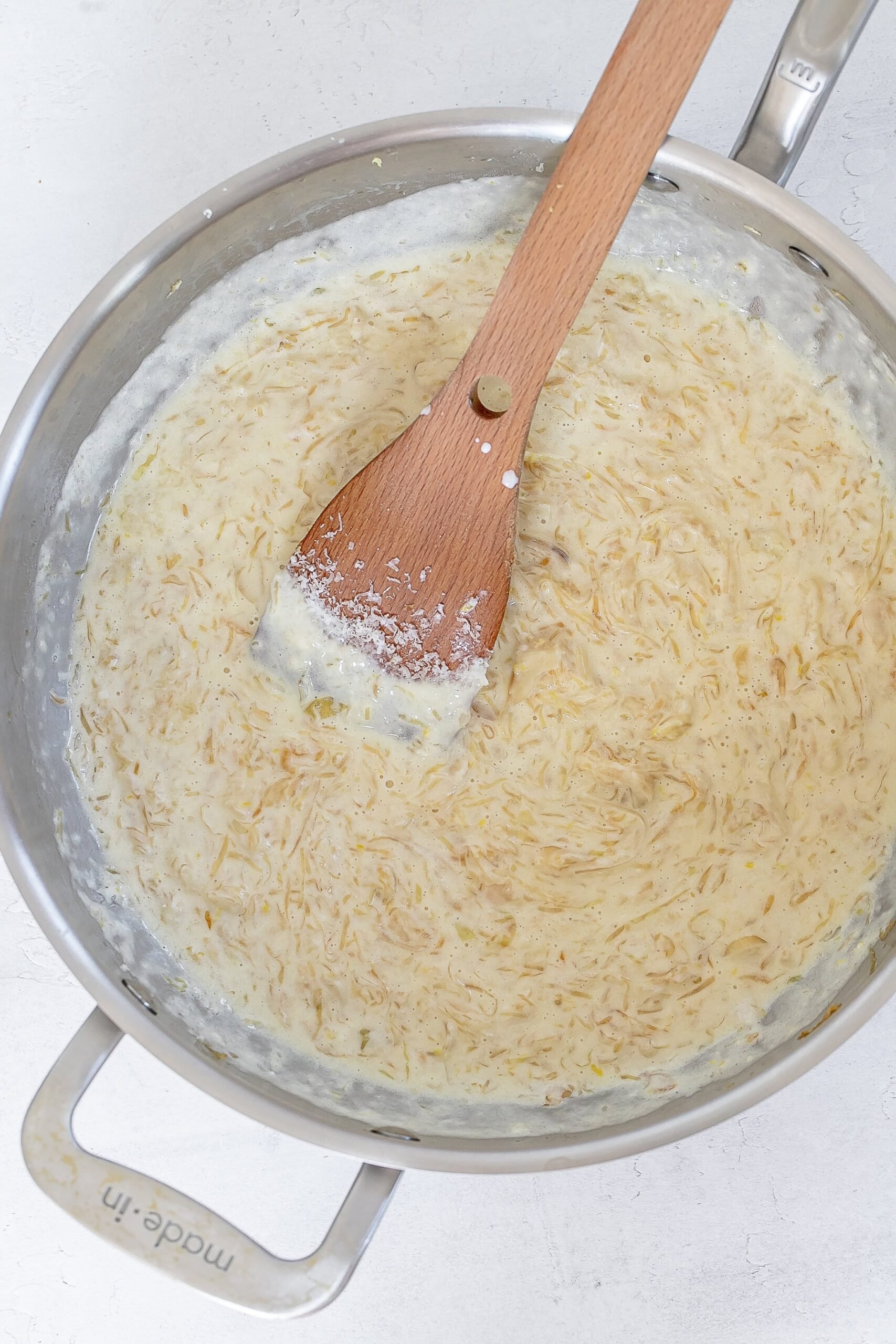 cabbage and onions in skillet with cream.