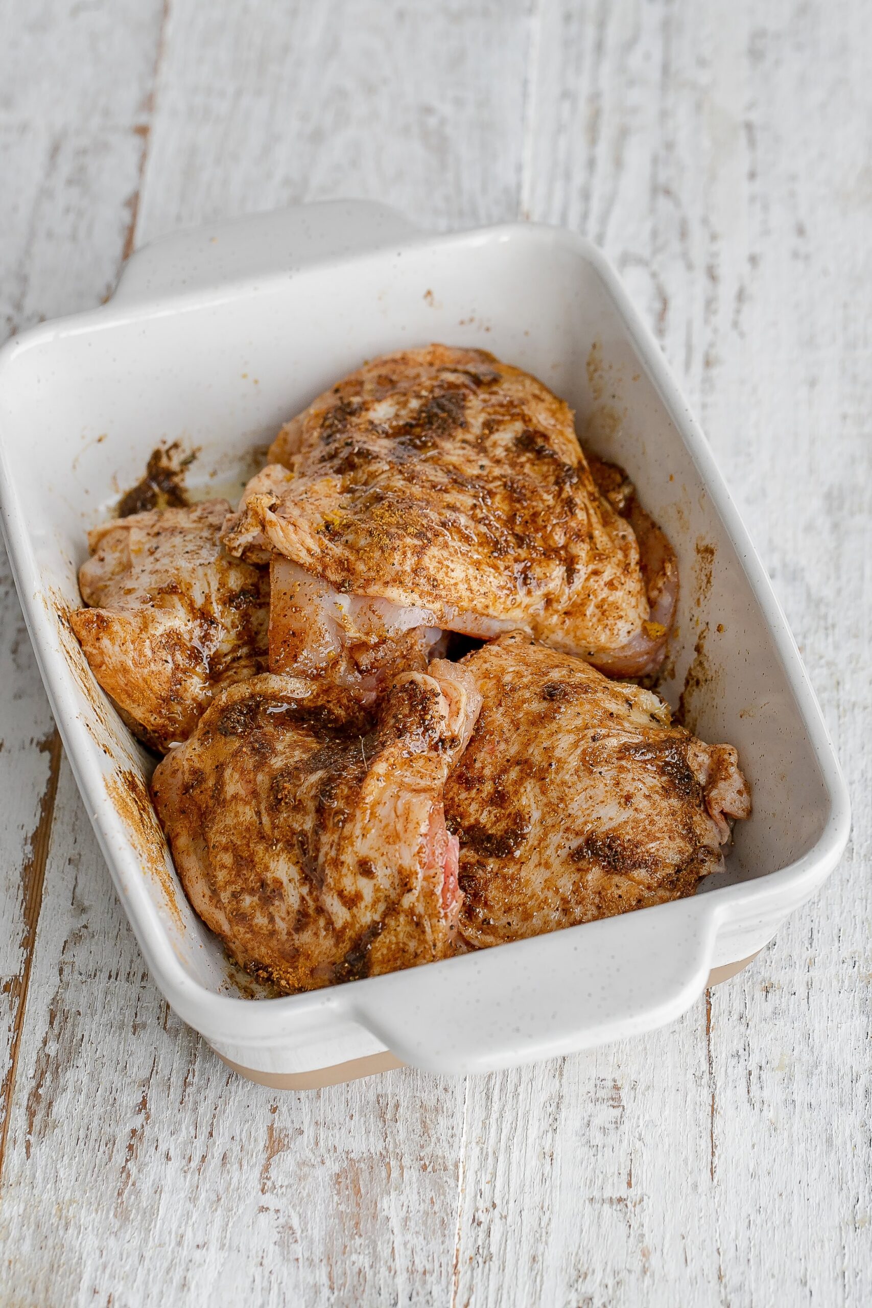 chicken thighs marinating with ras el hanout.