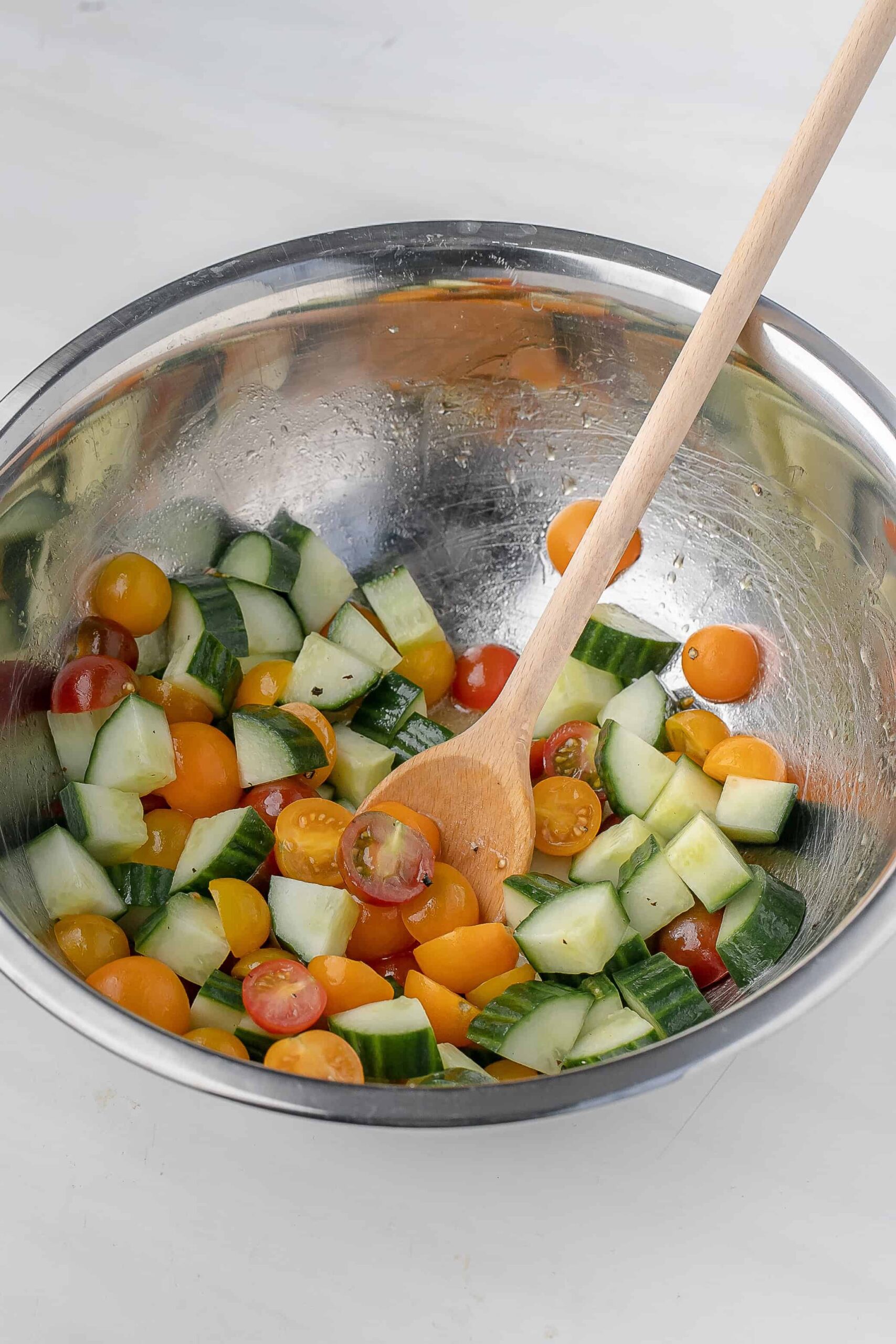 cherry tomato and cucumber salad in a large bowl. 