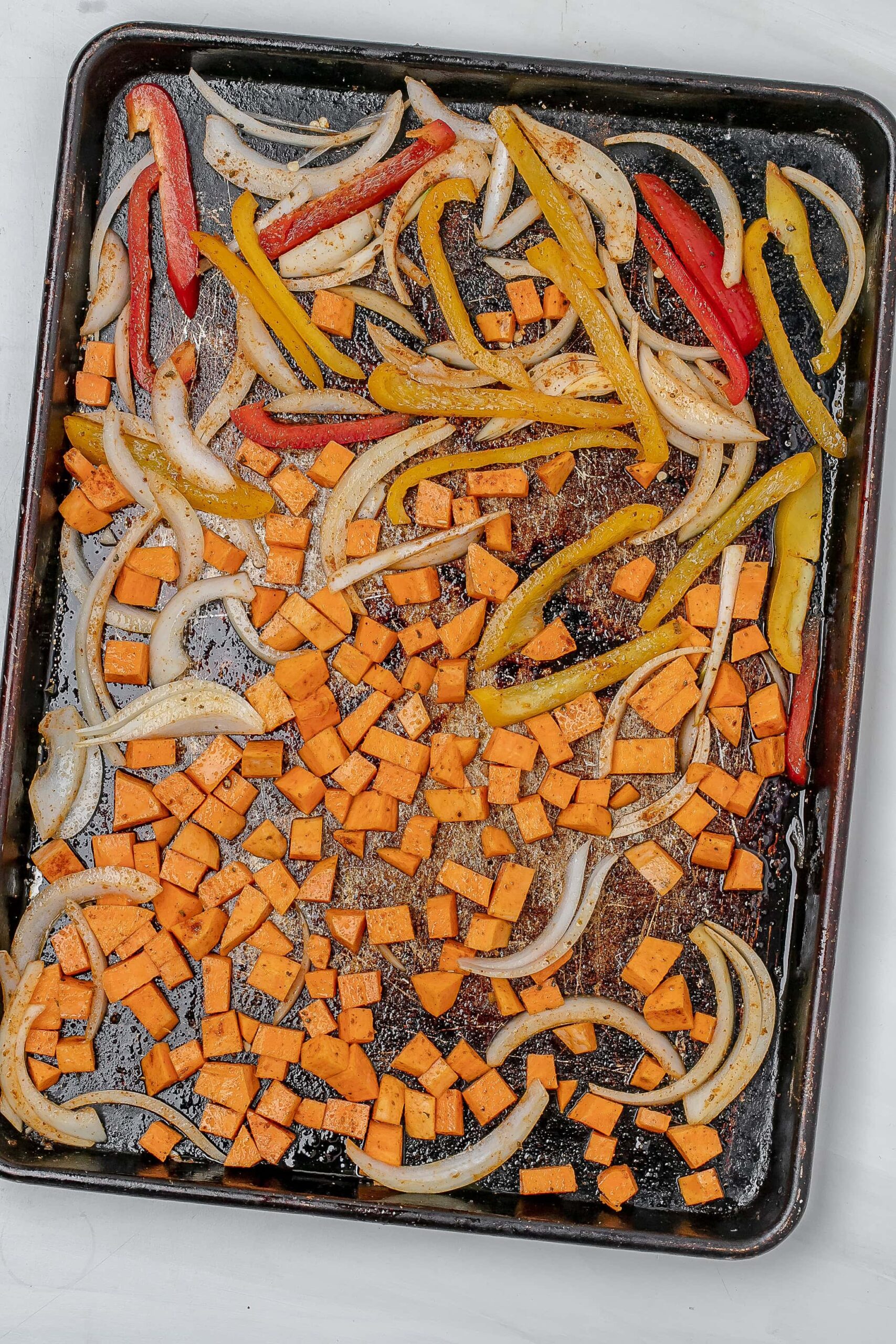 veggies on a baking sheet before going in the oven.
