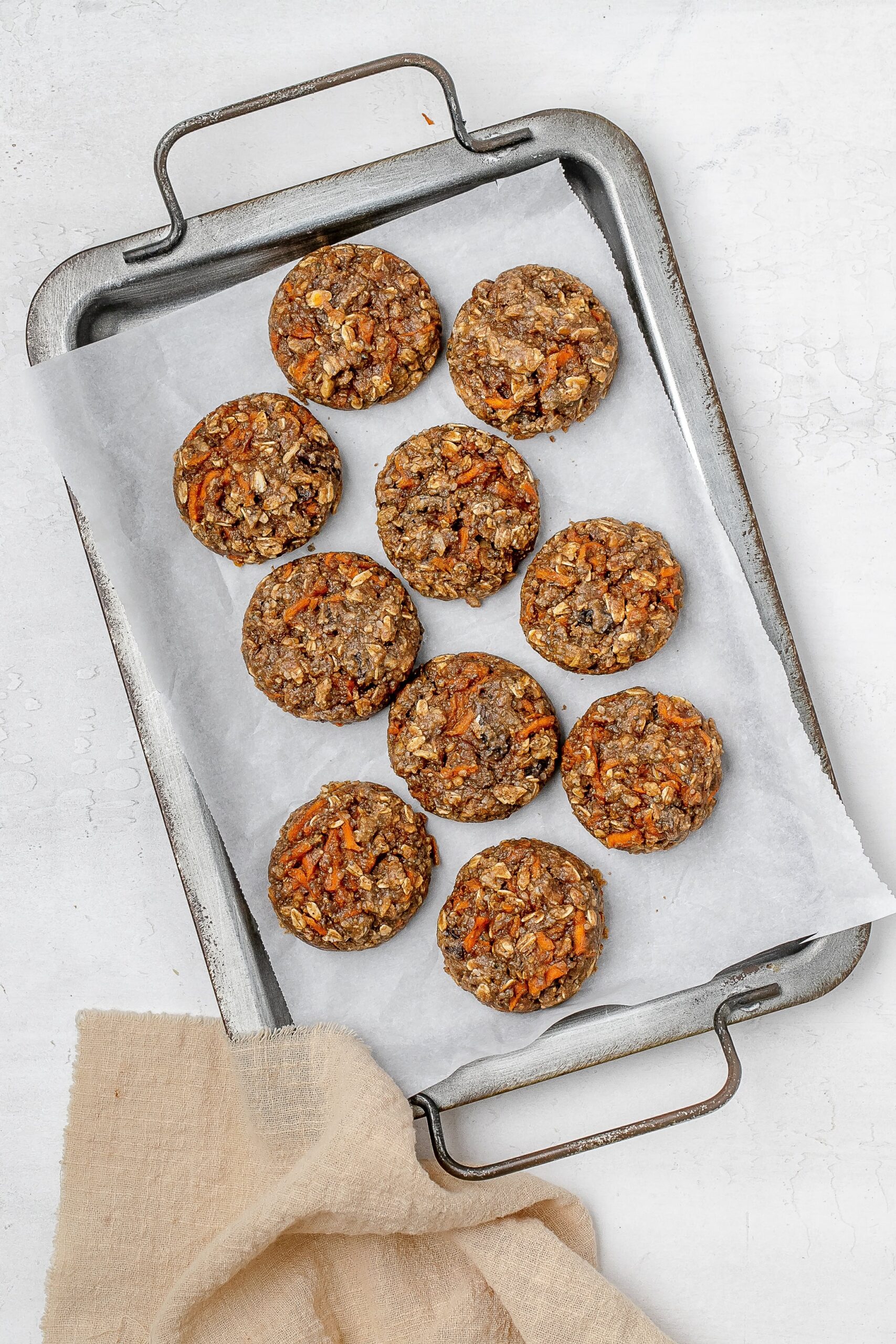 carrot cake breakfast cookies on a baking sheet.