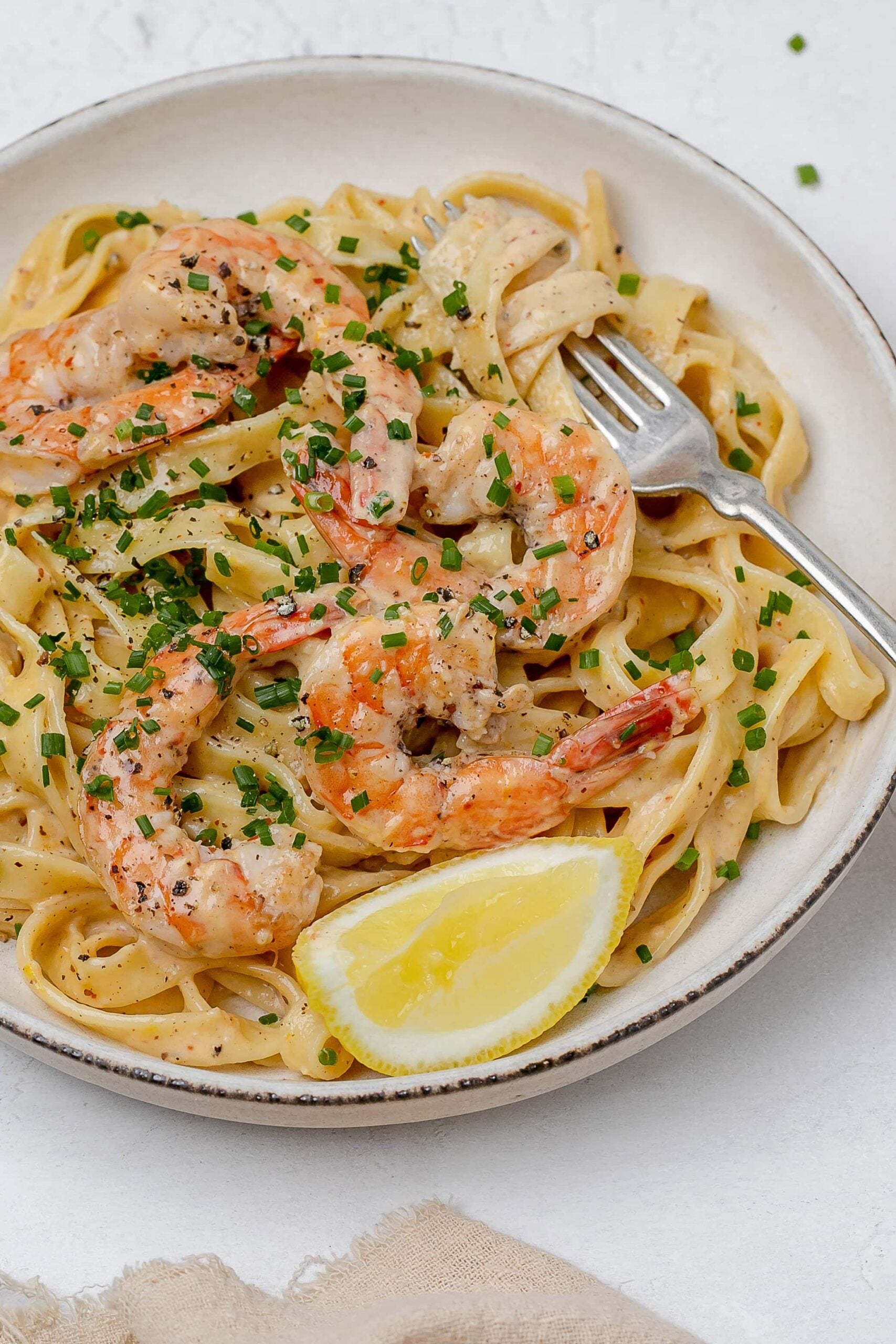 creamy lemon pasta with shrimp on a plate. 