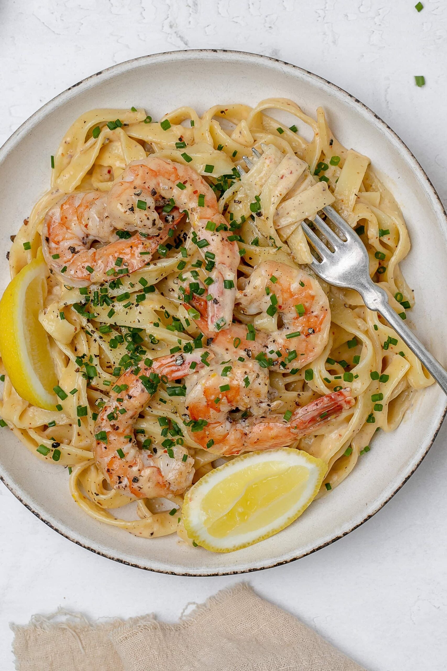 creamy lemon pasta with shrimp on a plate. 