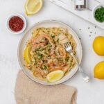 creamy lemon pasta with shrimp on a plate.