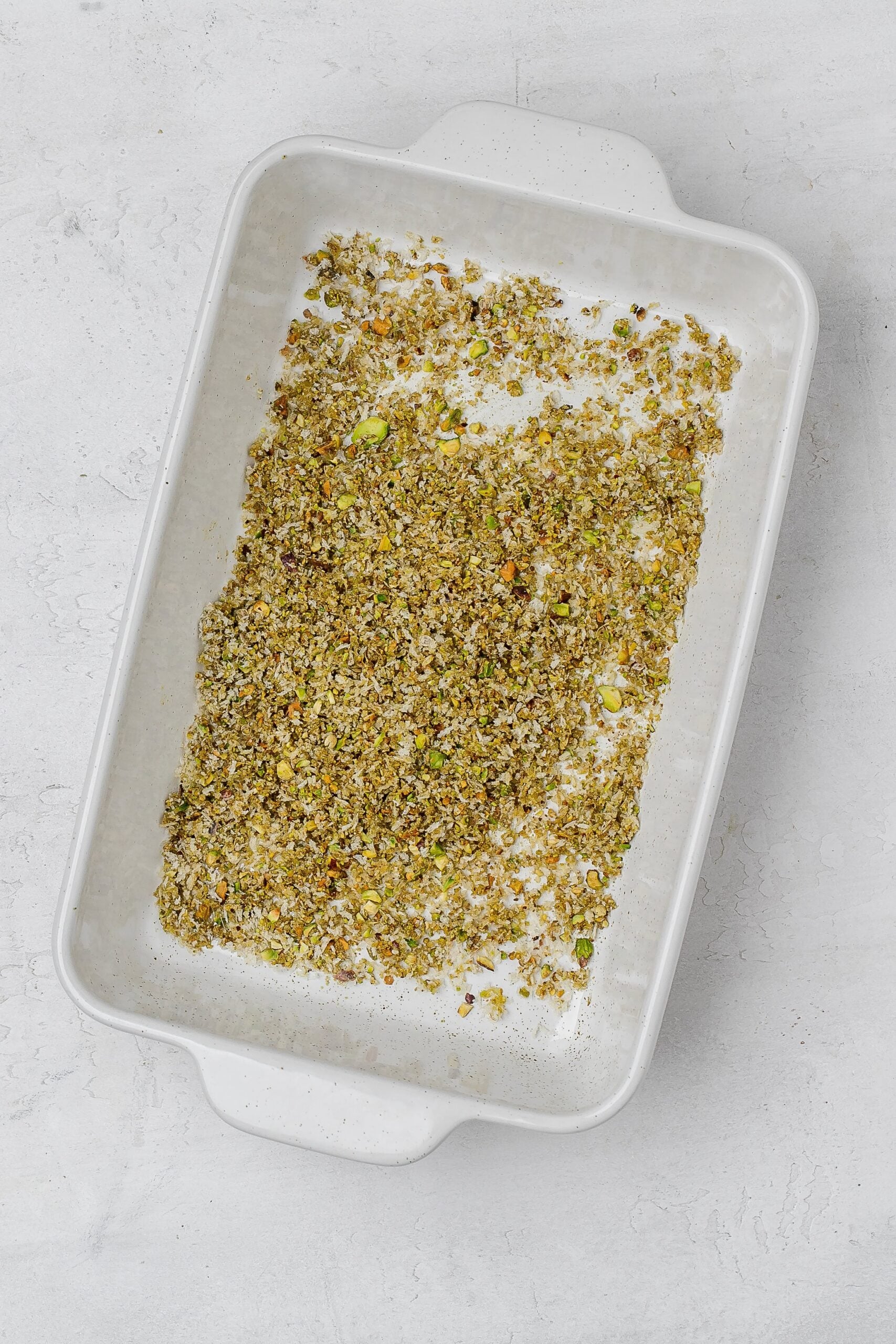 pistachio panko mixture in baking dish.