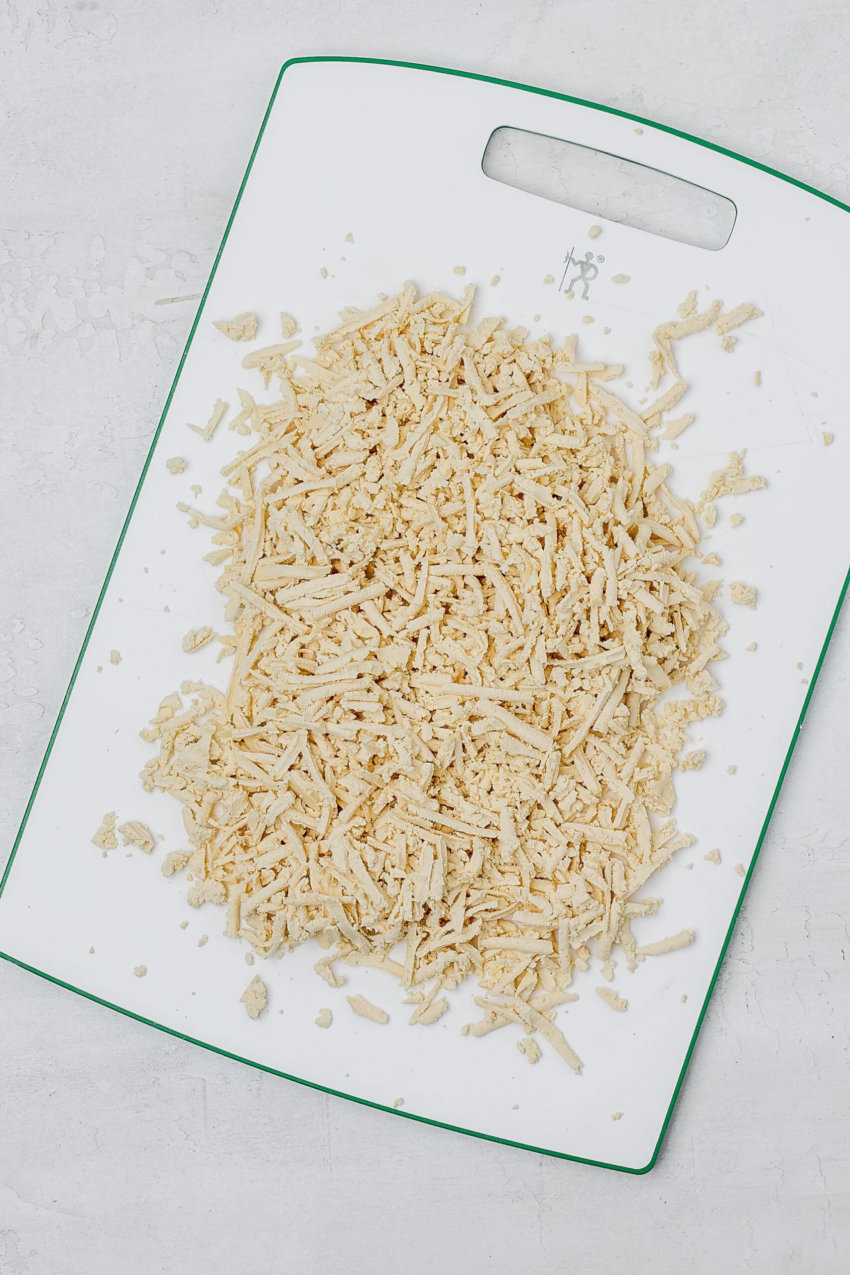 grated tofu on cutting board.