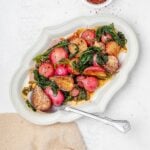 sautéed radishes on a platter with butter sauce.