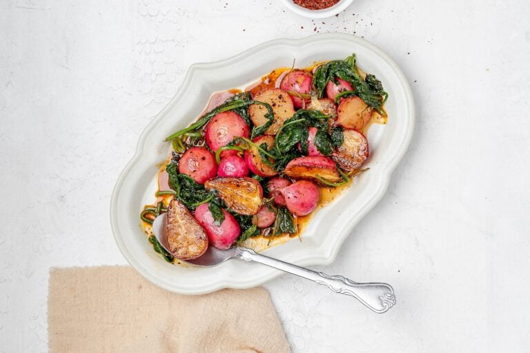 sautéed radishes on a platter with butter sauce.