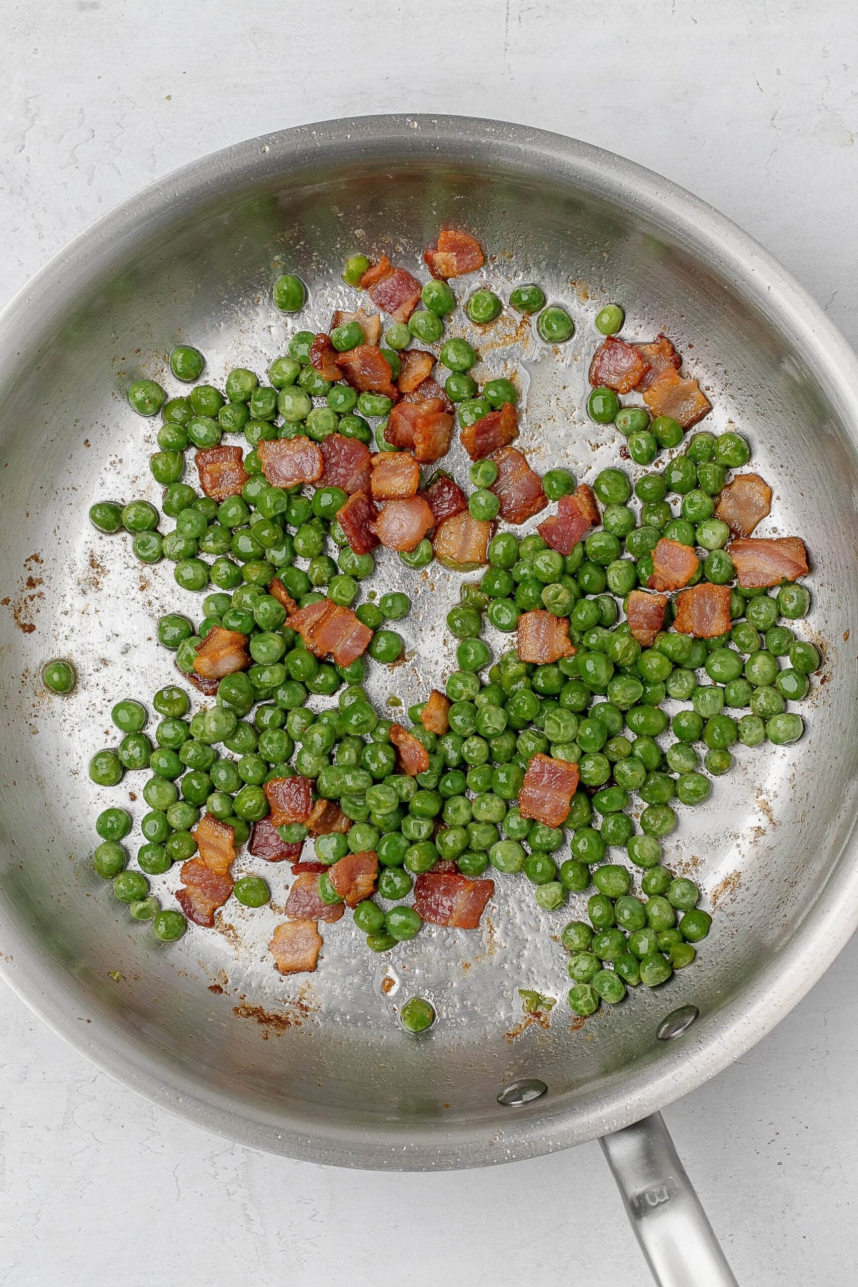 peas and bacon in skillet. 