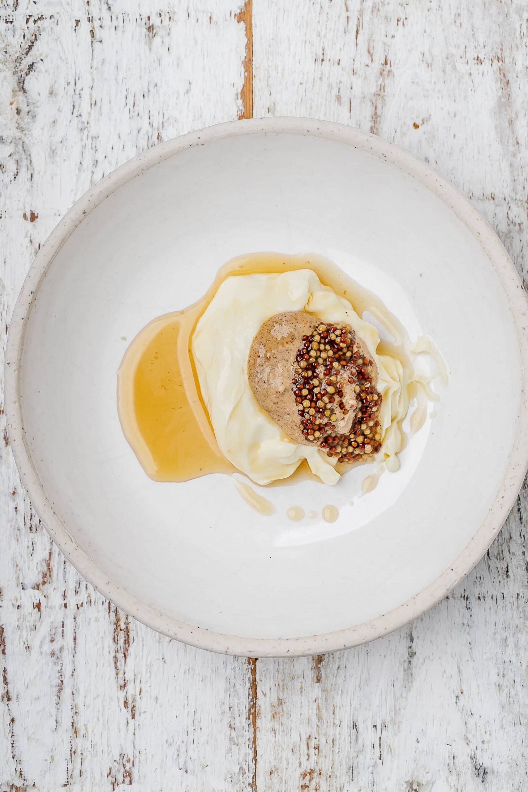 mayo, mustard and maple syrup in a bowl.