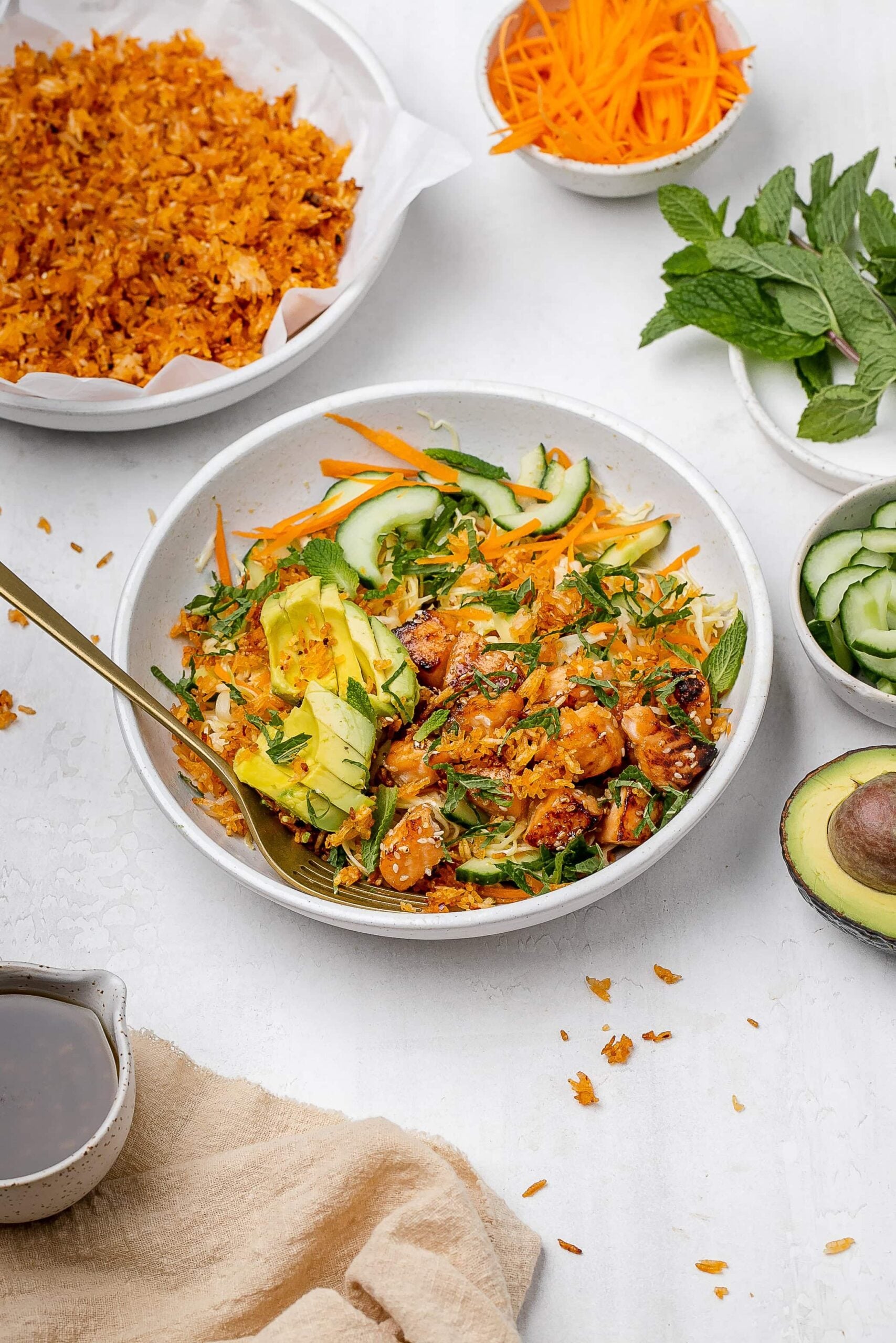crispy rice salad with salmon in a salad bowl.