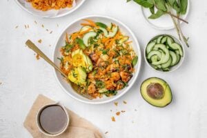 crispy rice salad with salmon in a salad bowl.