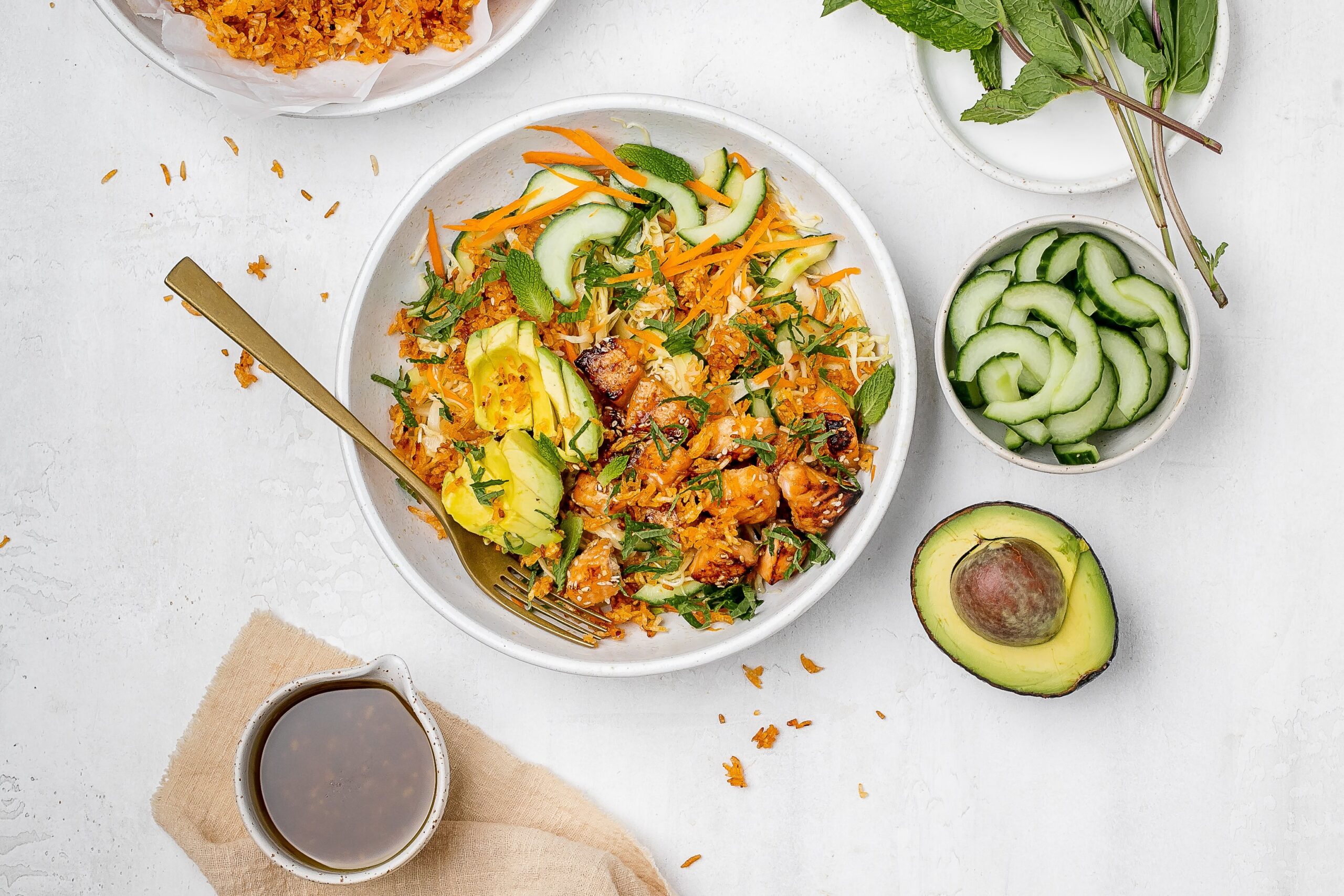crispy rice salad with salmon in a salad bowl.