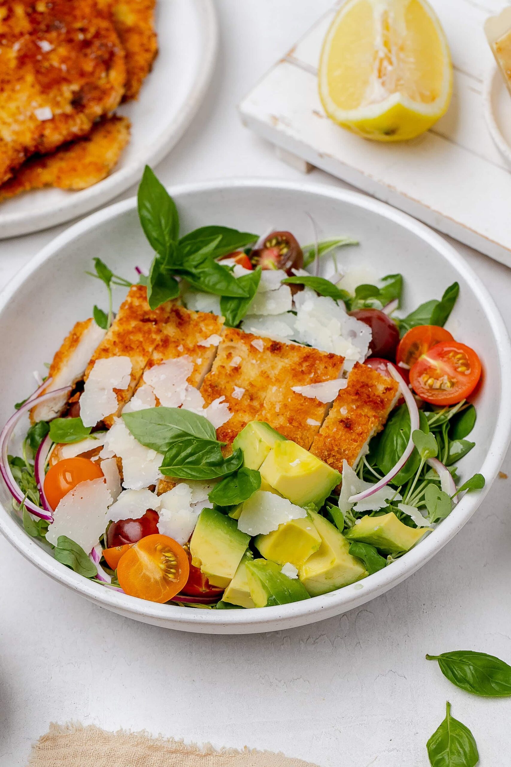 chicken Milanese salad in a bowl.