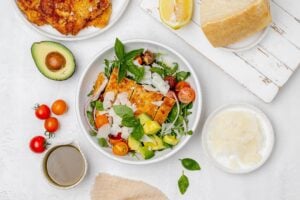 chicken Milanese salad in a bowl.